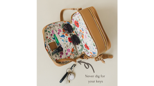 Photo of interior of the Poppy bag, highlighting the attached key leash. 